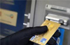 Two held for withdrawing cash from ATM card of a woman